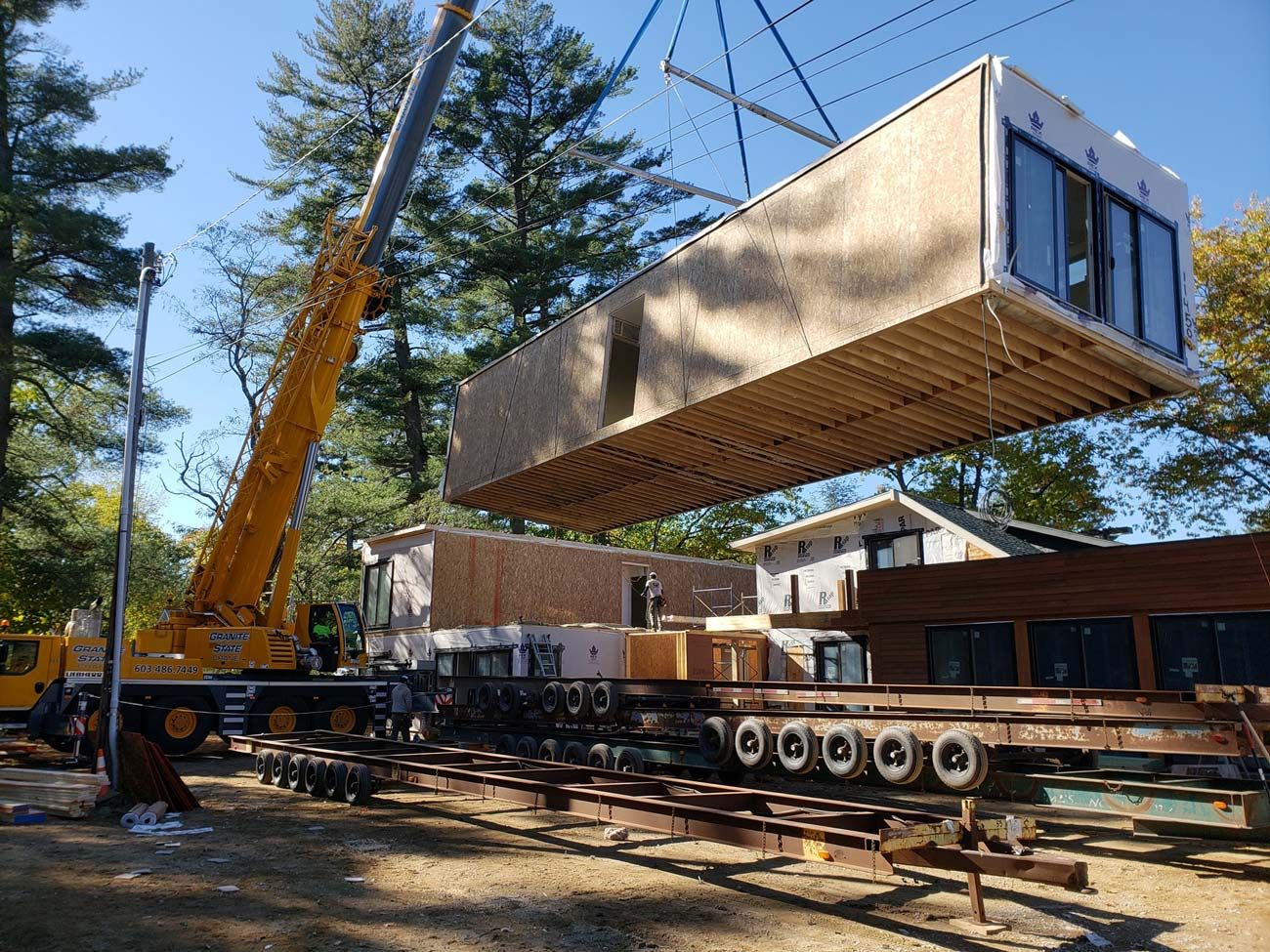A Granite State Crane all-terrain crane setting a modular home section
